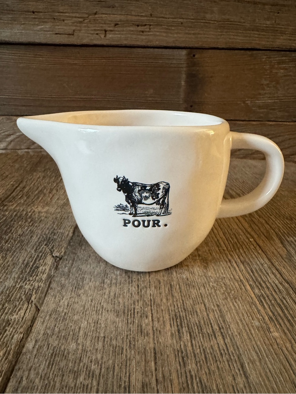 Rae Dunn “Pour.” Ceramic creamer with Cow Graphic